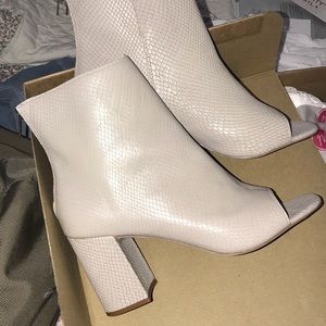 snakeskin booties w/ a 3 in heel